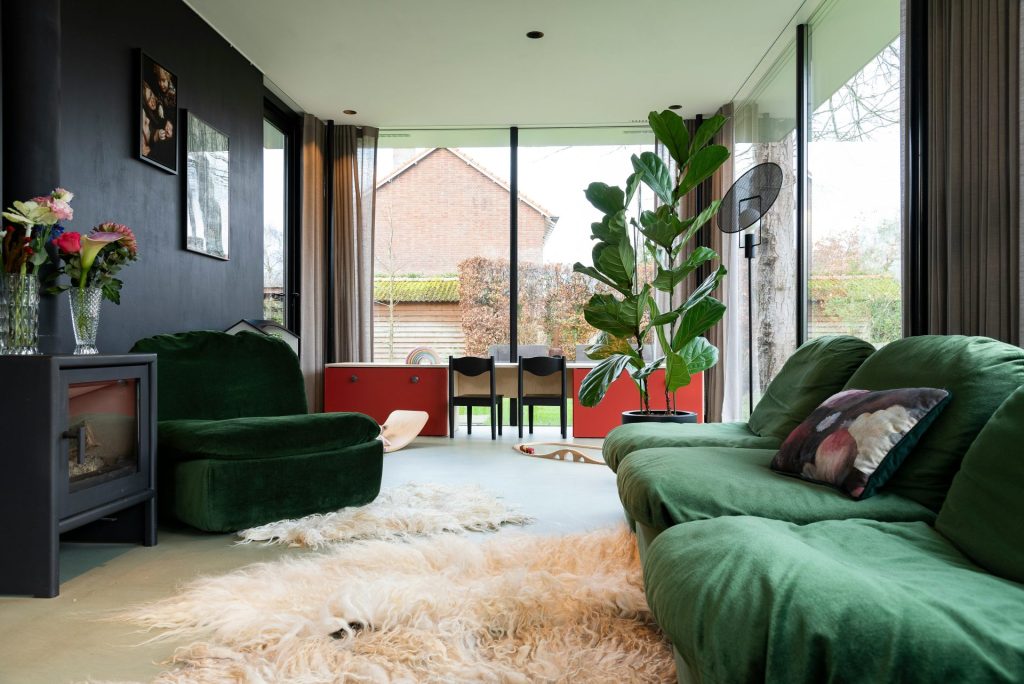 green sofa chair near green potted plant